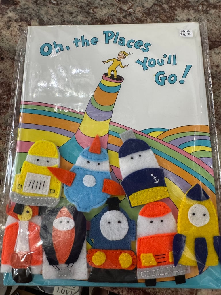 Oh, the Places Youll Go book cover with colorful felt character figures arranged below the title