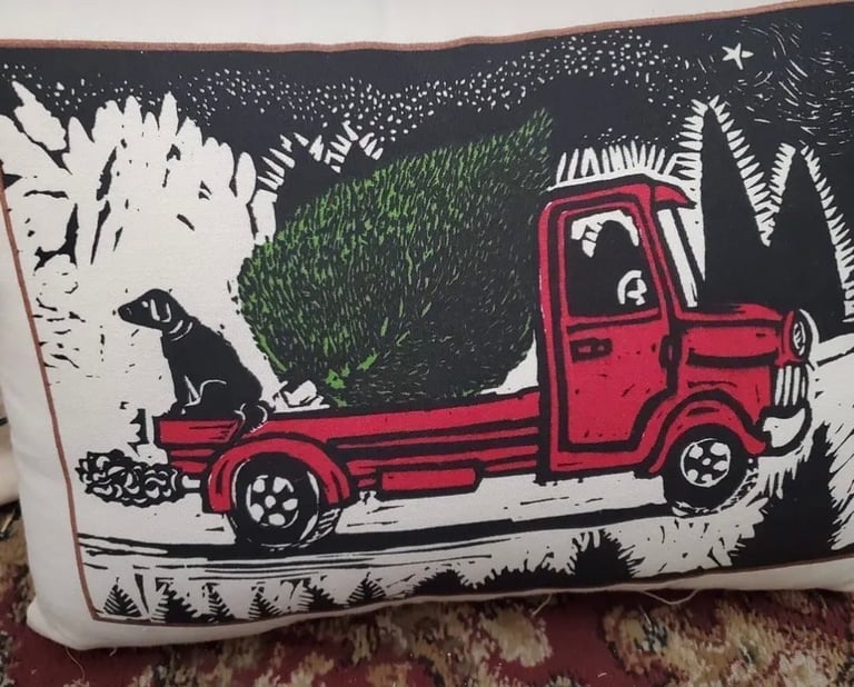 Illustration of a red vintage truck with a dog in the bed, surrounded by stylized foliage and nighttime scenery